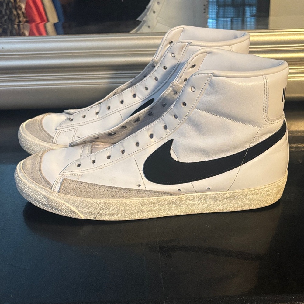 Nike White High-Top Sneakers with Black Swoosh